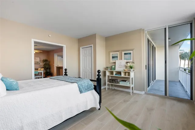 a bedroom with a bed and a view of en suite bathroom