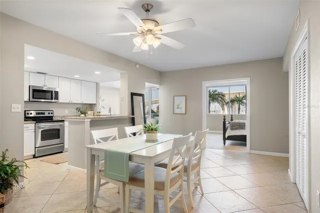 a view of kitchen with refrigerator stove and microwave