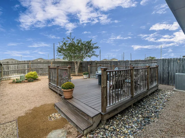 a view of balcony with furniture