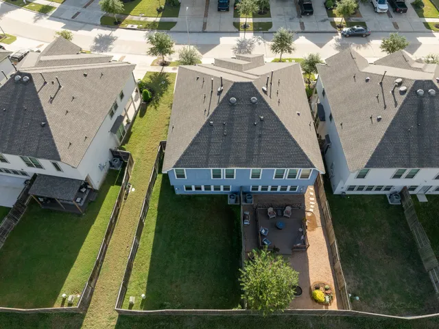 swimming pool view with a garden