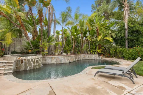 a view of a swimming pool with a yard