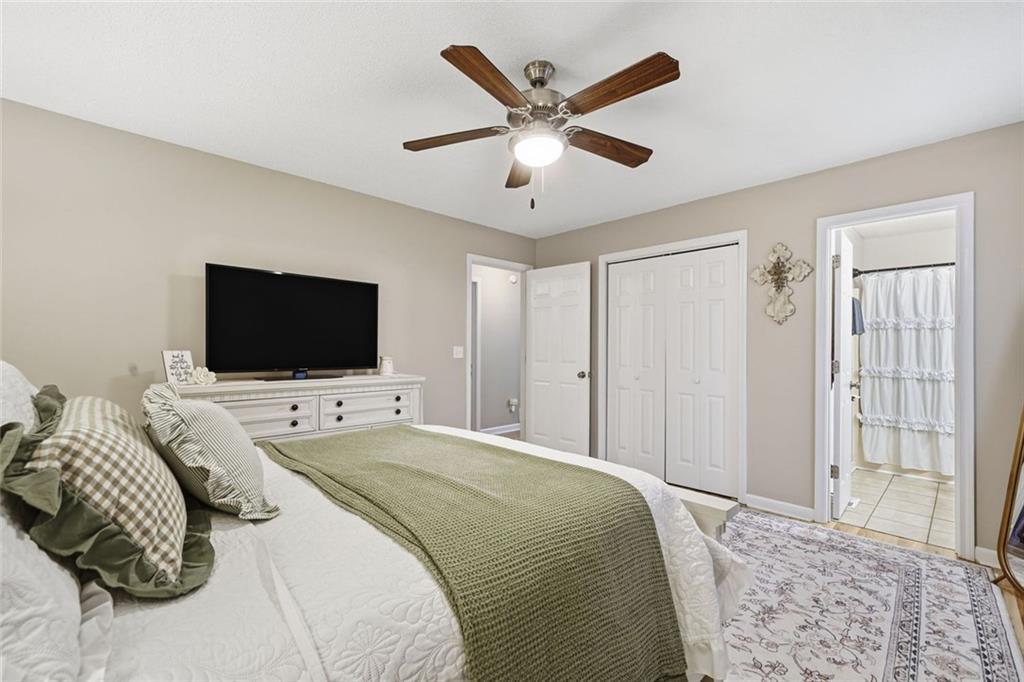 2525 Henderson Mountain Road Jasper, GA 30143 - Photo 15 of 23 a bedroom with a bed tv and a window