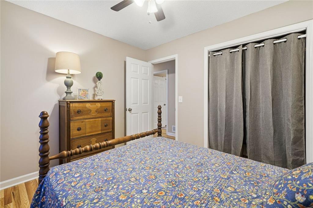 2525 Henderson Mountain Road Jasper, GA 30143 - Photo 18 of 23 a bedroom with a bed and wooden floor