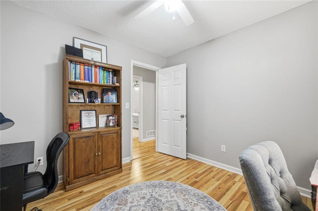 2525 Henderson Mountain Road Jasper, GA 30143 - Photo 19 of 23 a bedroom with furniture and a book shelf