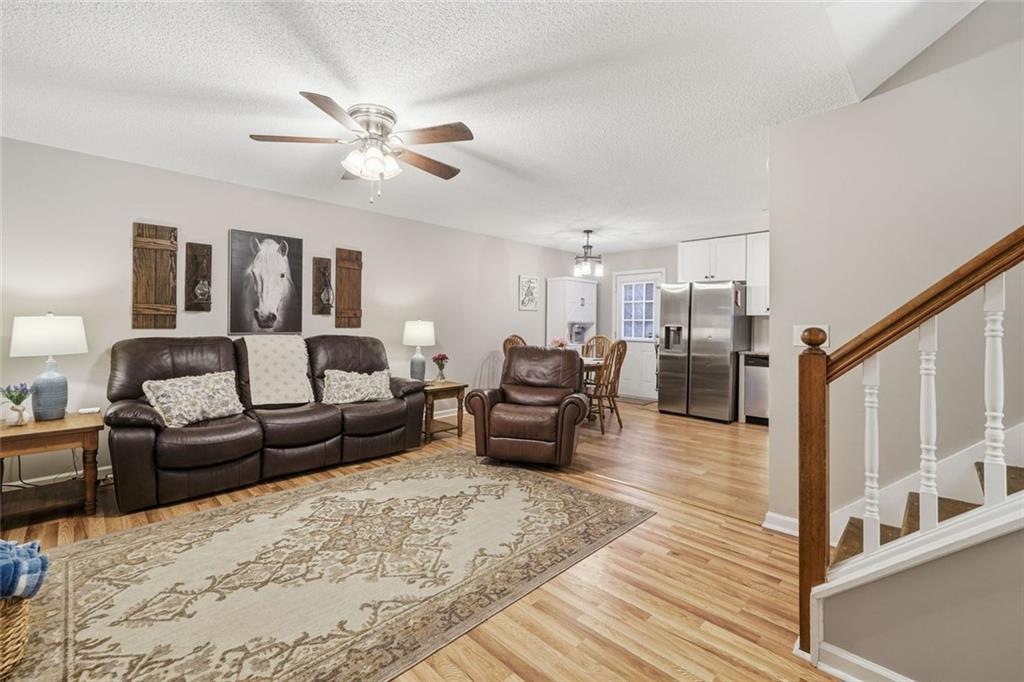 2525 Henderson Mountain Road Jasper, GA 30143 - Photo 4 of 23 a living room with furniture and wooden floor