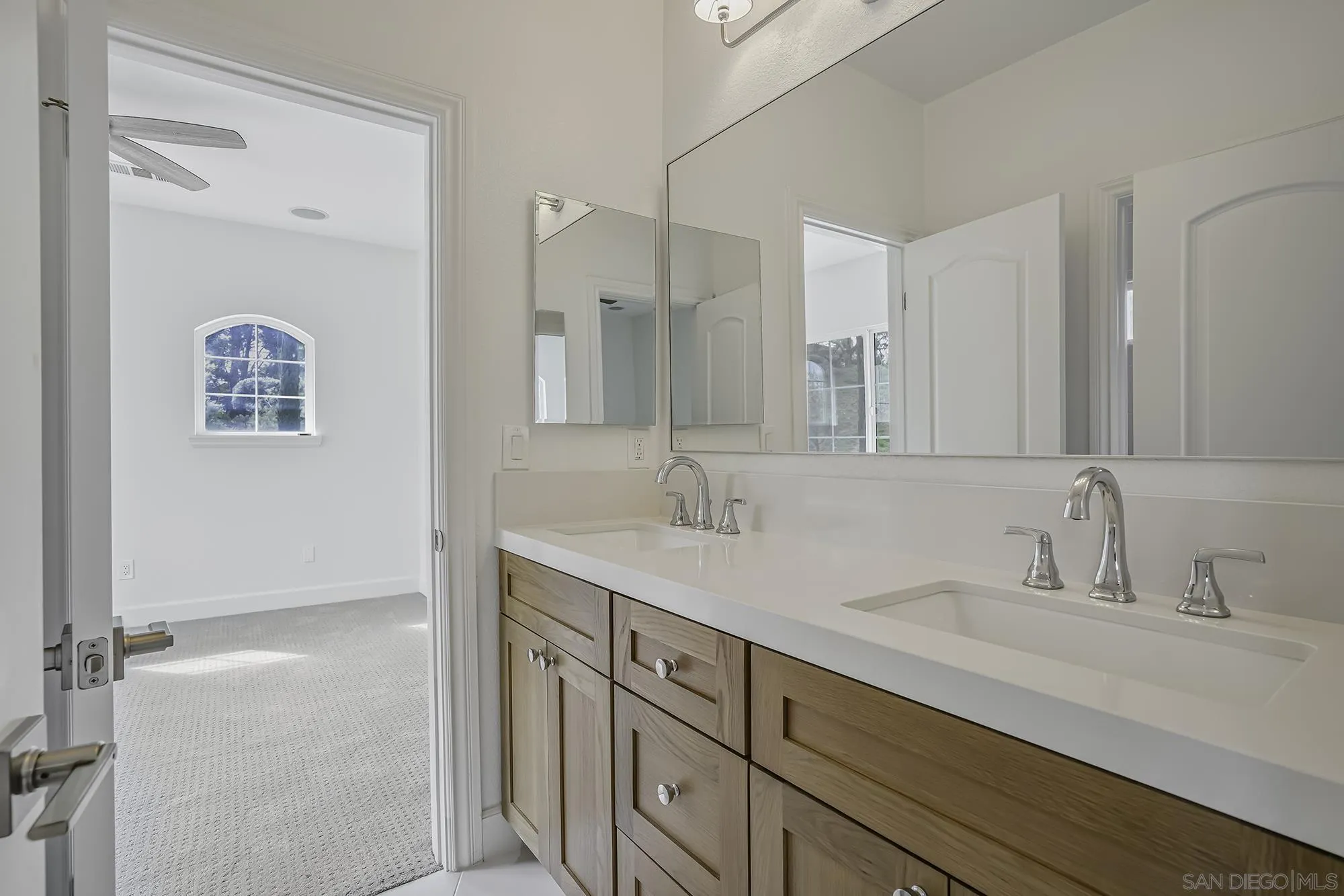 3737 Keri Way Fallbrook, CA 92028 - Photo 24 of 43 a bathroom with a sink and a mirror