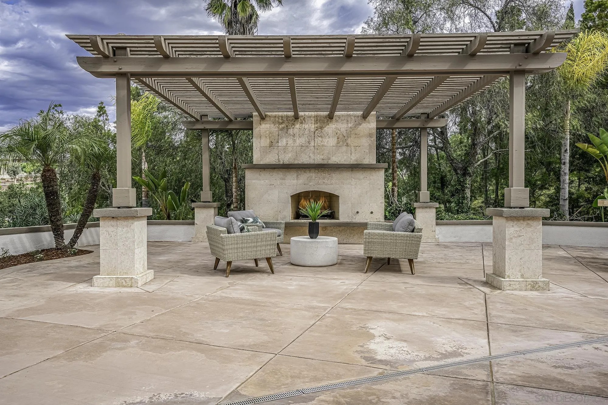 3737 Keri Way Fallbrook, CA 92028 - Photo 28 of 43 a view of a patio with a table and chairs potted plants
