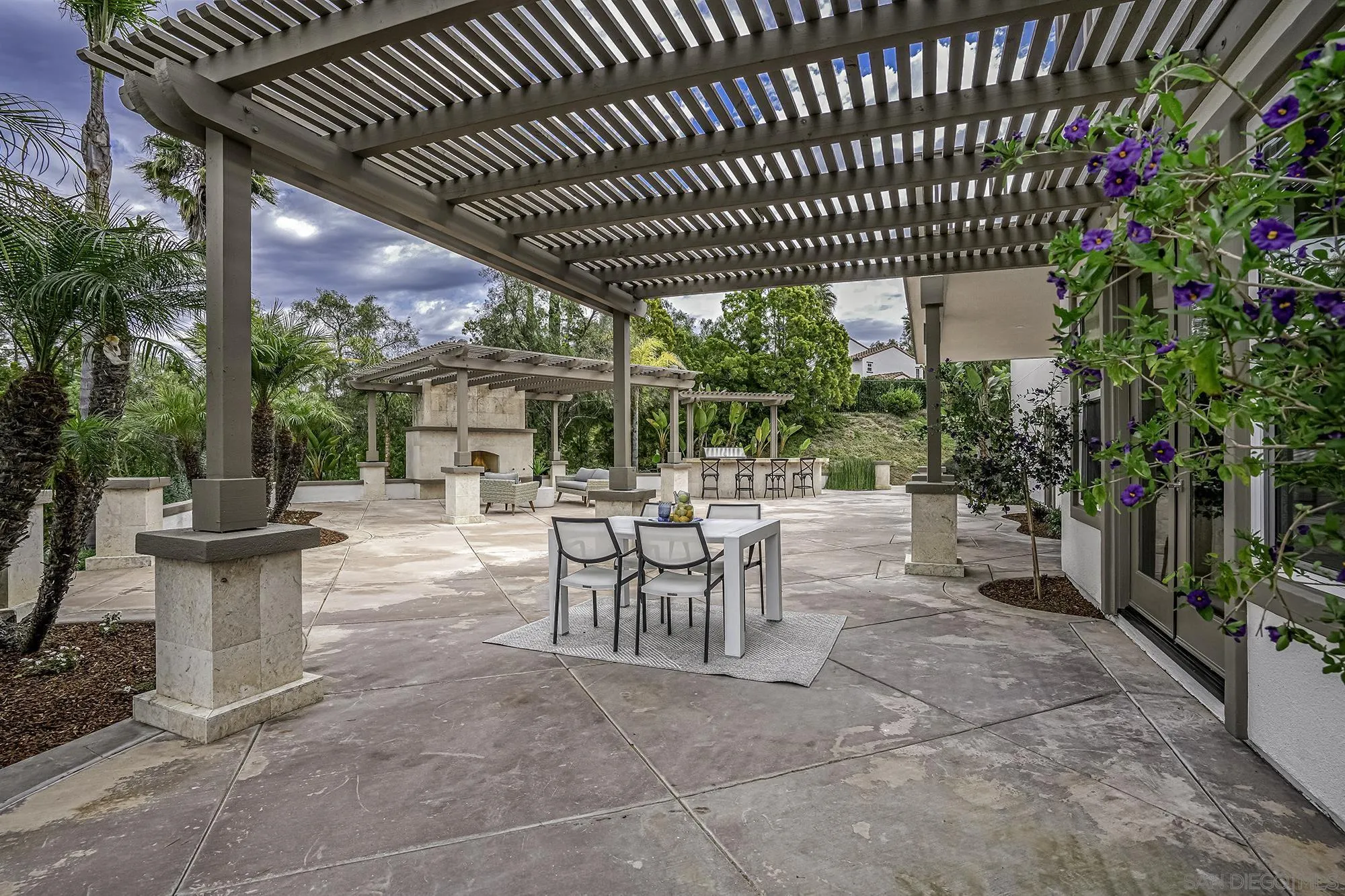 3737 Keri Way Fallbrook, CA 92028 - Photo 30 of 43 a view of a patio with table and chairs and potted plants