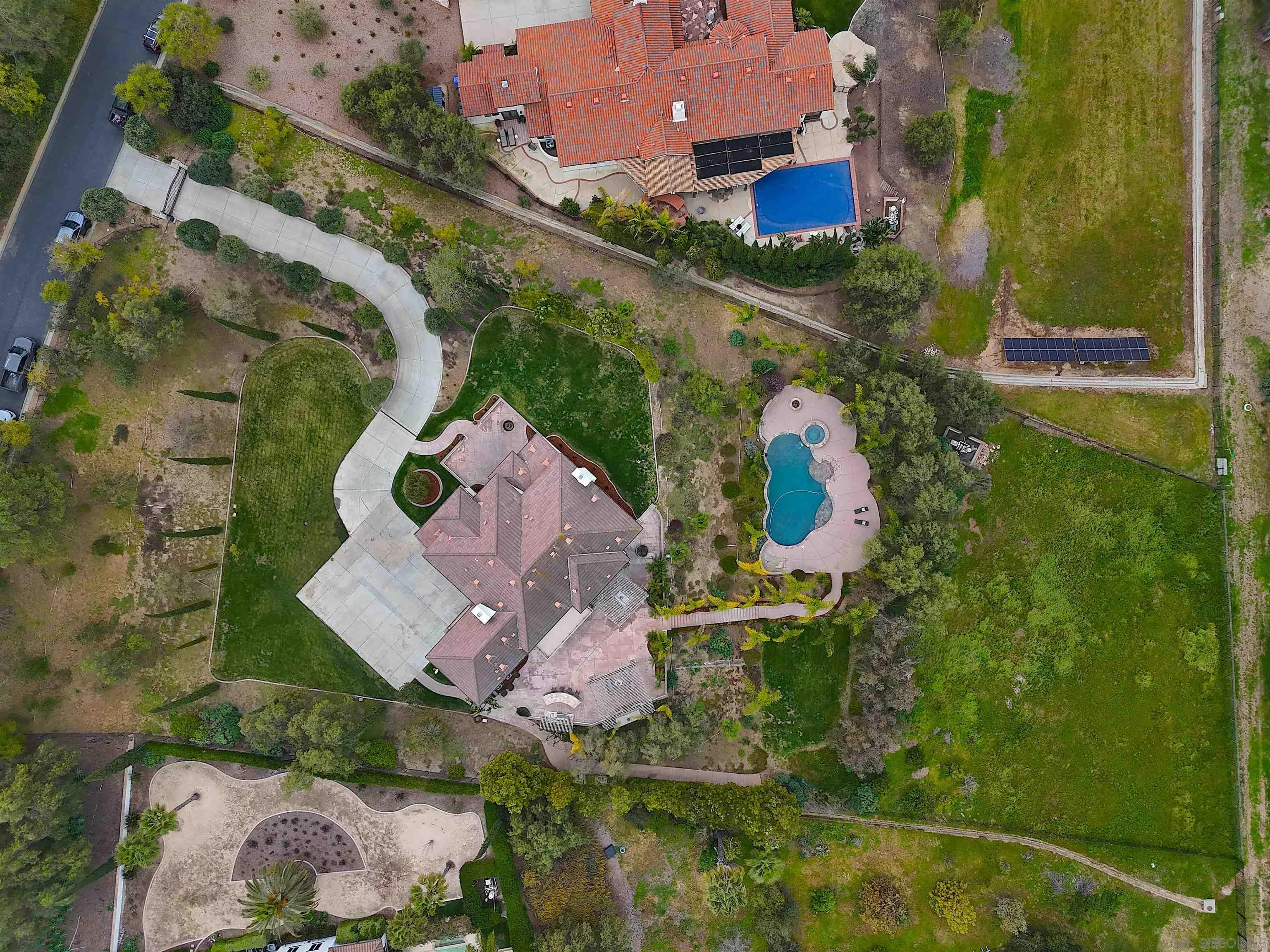 3737 Keri Way Fallbrook, CA 92028 - Photo 42 of 43 an aerial view of a house with a yard and greenery