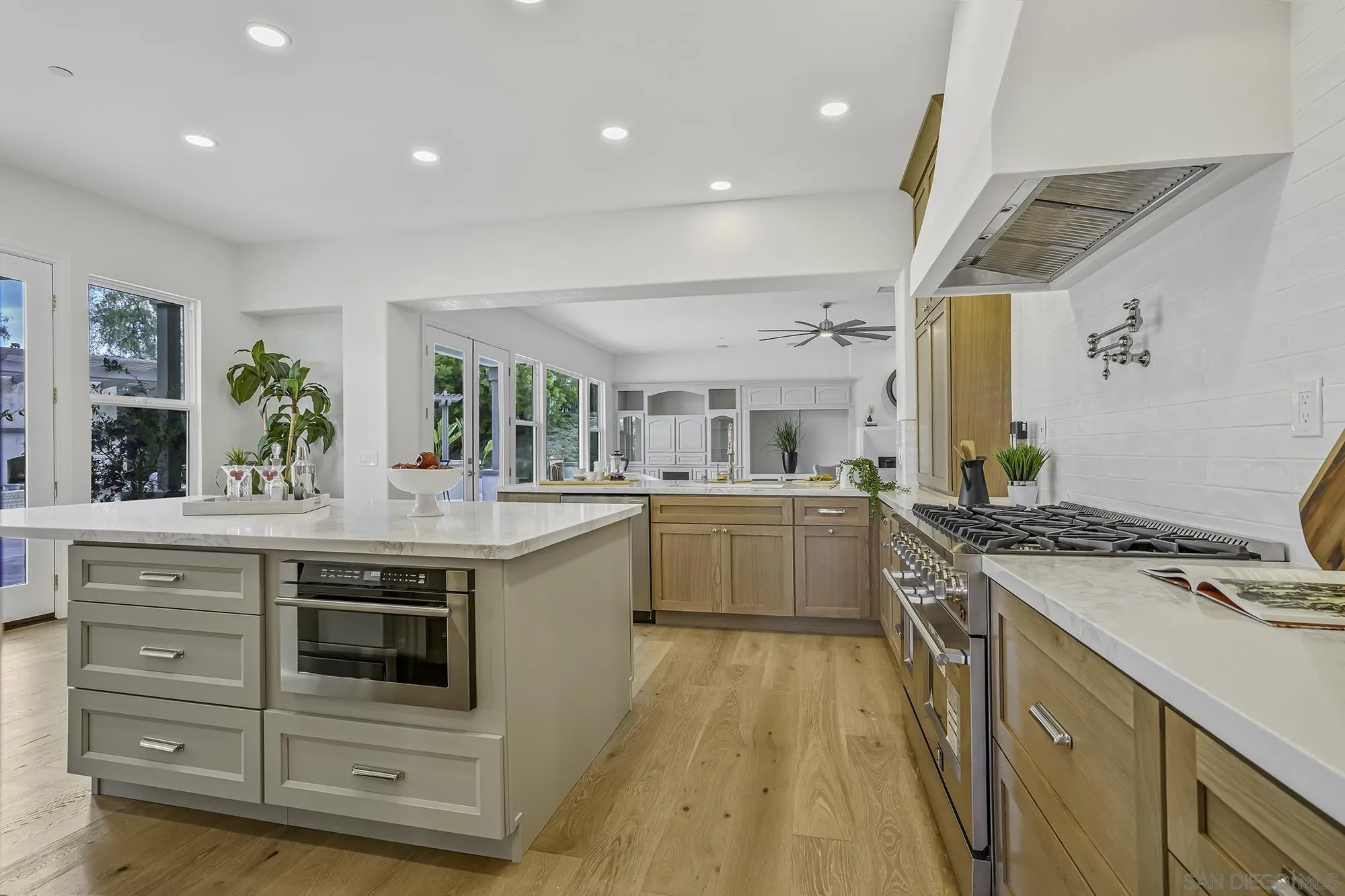 3737 Keri Way Fallbrook, CA 92028 - Photo 7 of 43 a kitchen with a sink stove and cabinets
