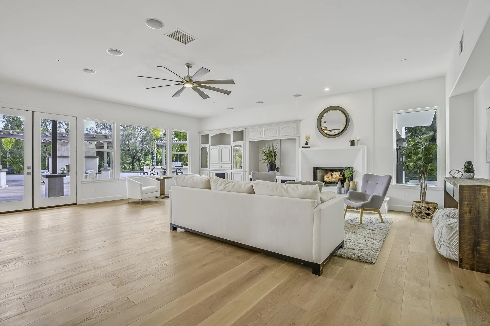 3737 Keri Way Fallbrook, CA 92028 - Photo 8 of 43 a living room with furniture a fireplace and a large window
