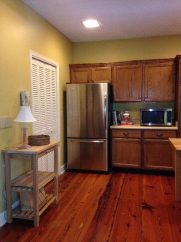 1872 Wood Valley Road Macon, GA 31211 - Photo 9 of 28 a kitchen with stainless steel appliances wooden floors and wooden cabinets