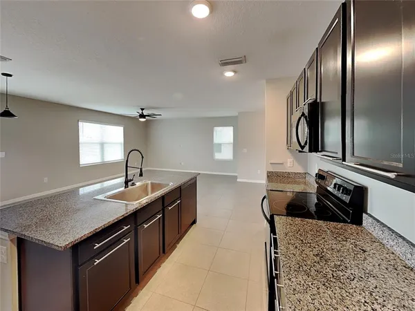 a kitchen with a stove and a sink