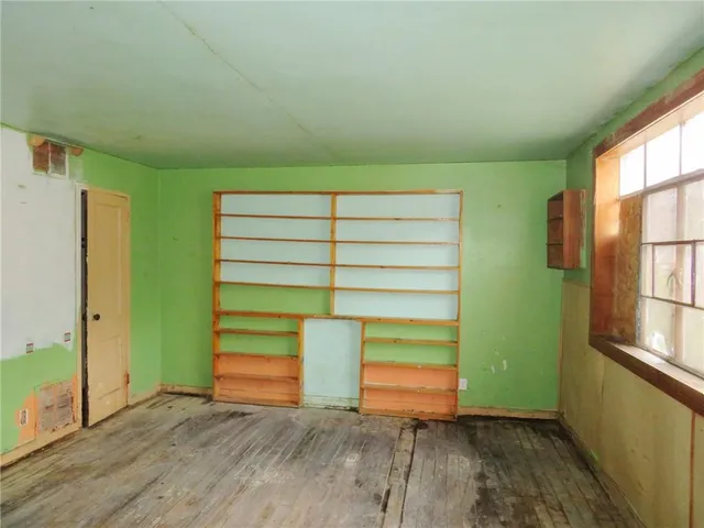 a view of room with window and stairs