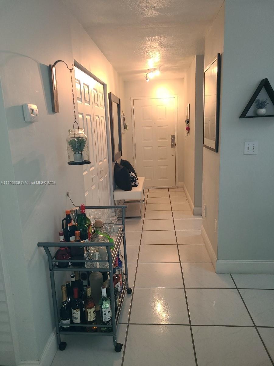 10030 Hammocks Boulevard, Unit 101 Miami, FL 33196 - Photo 14 of 27 a bathroom with a sink and a mirror