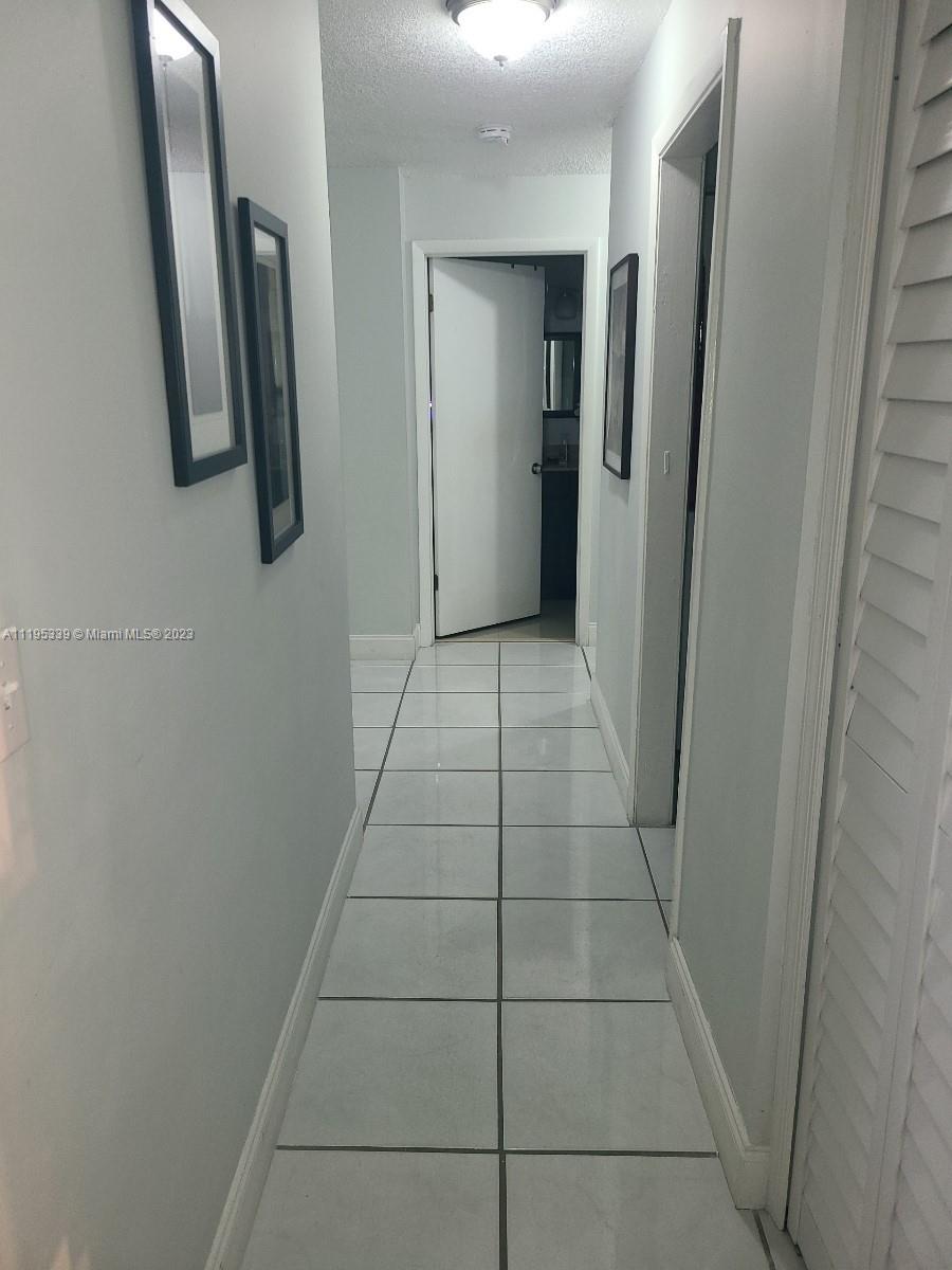 10030 Hammocks Boulevard, Unit 101 Miami, FL 33196 - Photo 24 of 27 a view of bathroom with a mirror