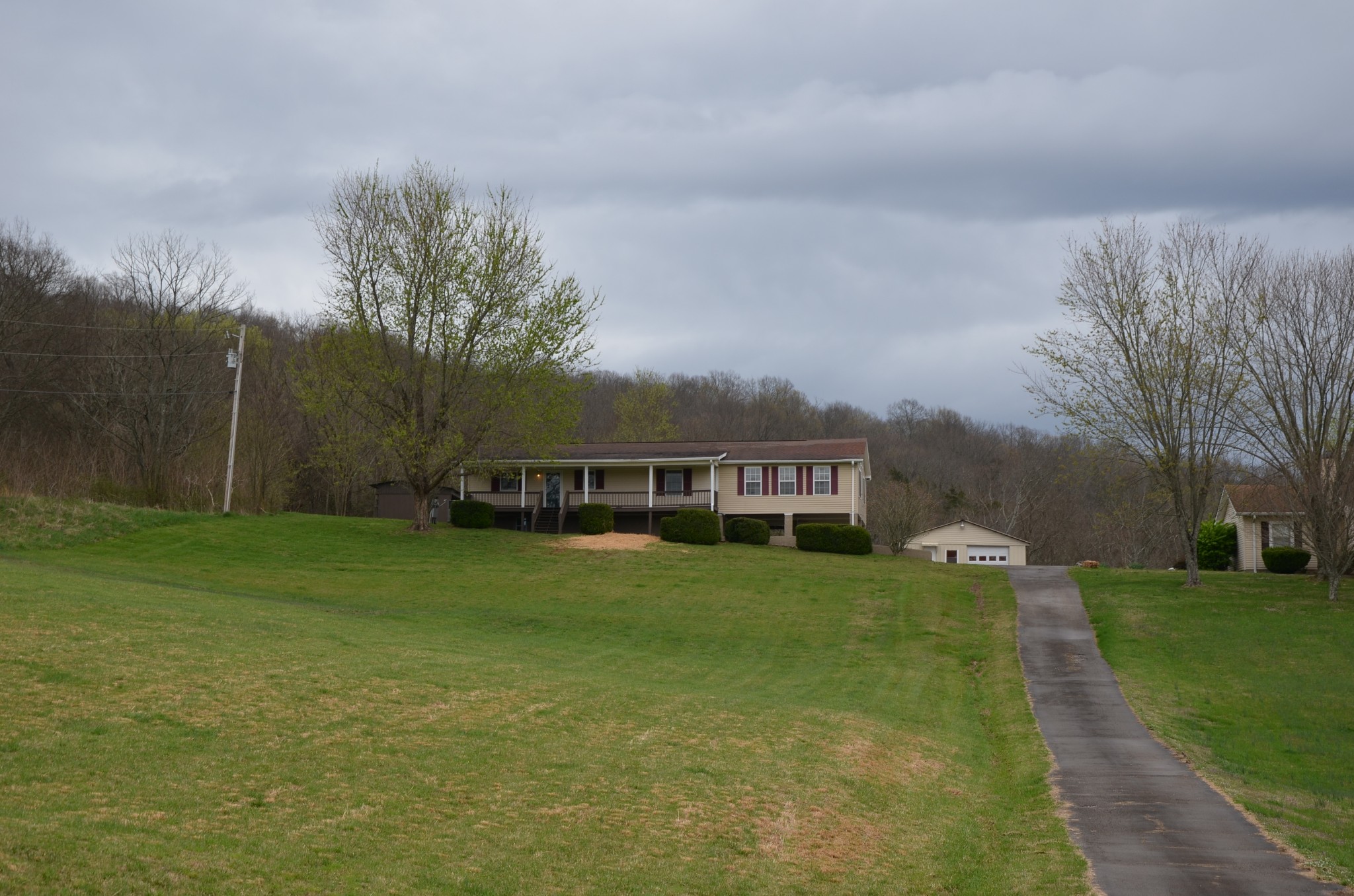 2742 Sherrilltown Road Watertown, TN 37184 - Photo 2 of 30 a view of a house with a big yard and large trees