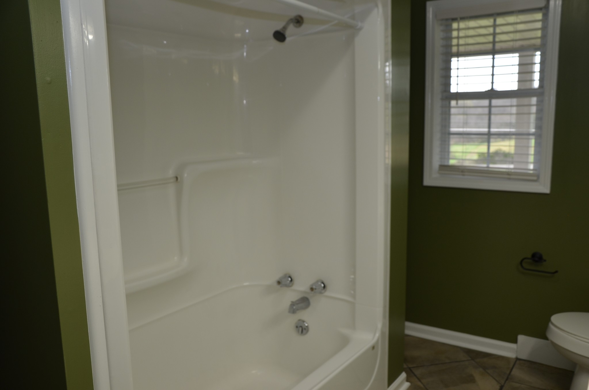2742 Sherrilltown Road Watertown, TN 37184 - Photo 16 of 30 a bathroom with a bathtub and toilet