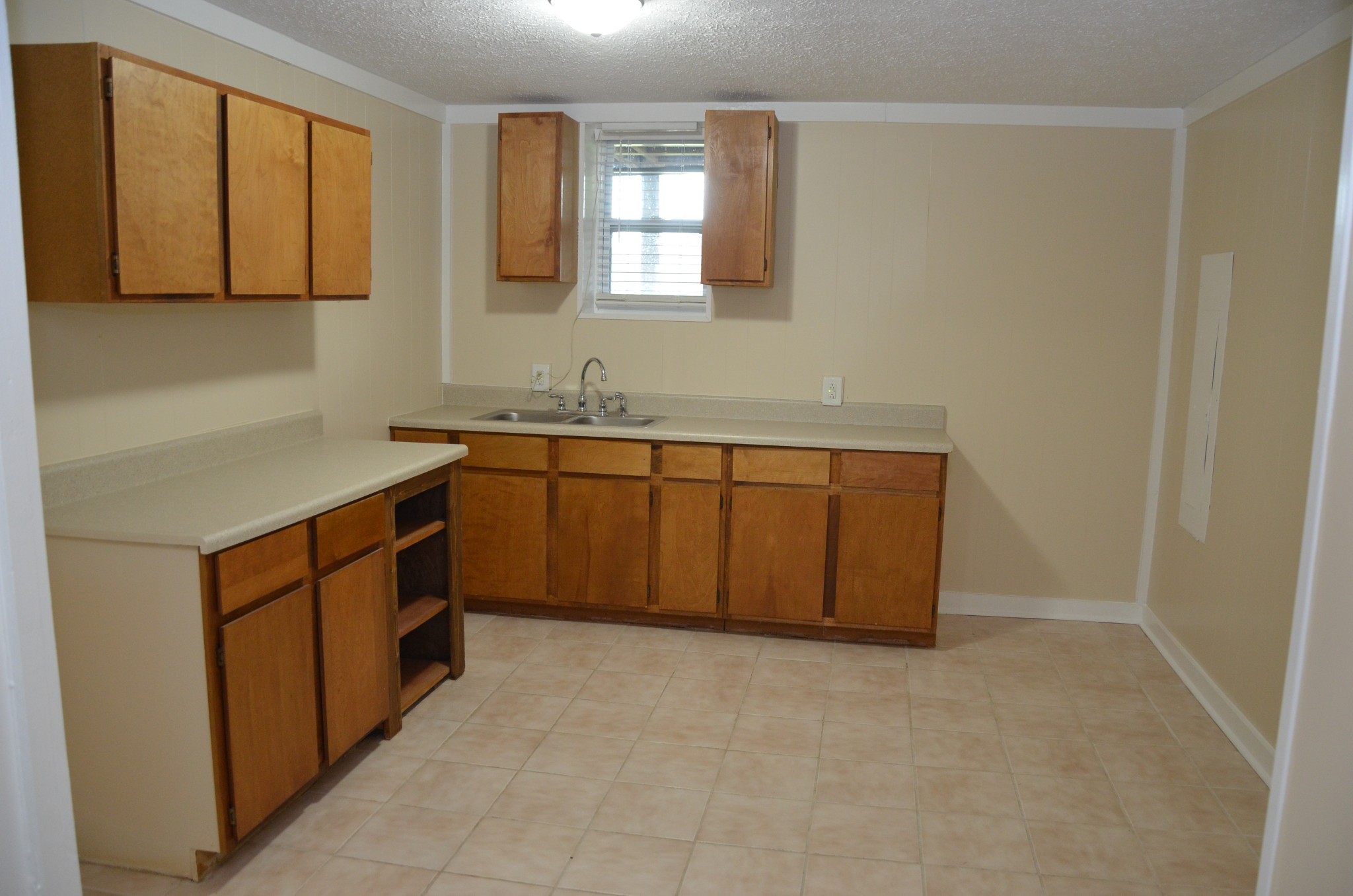 2742 Sherrilltown Road Watertown, TN 37184 - Photo 29 of 30 a kitchen with stainless steel appliances granite countertop a sink stove and cabinets