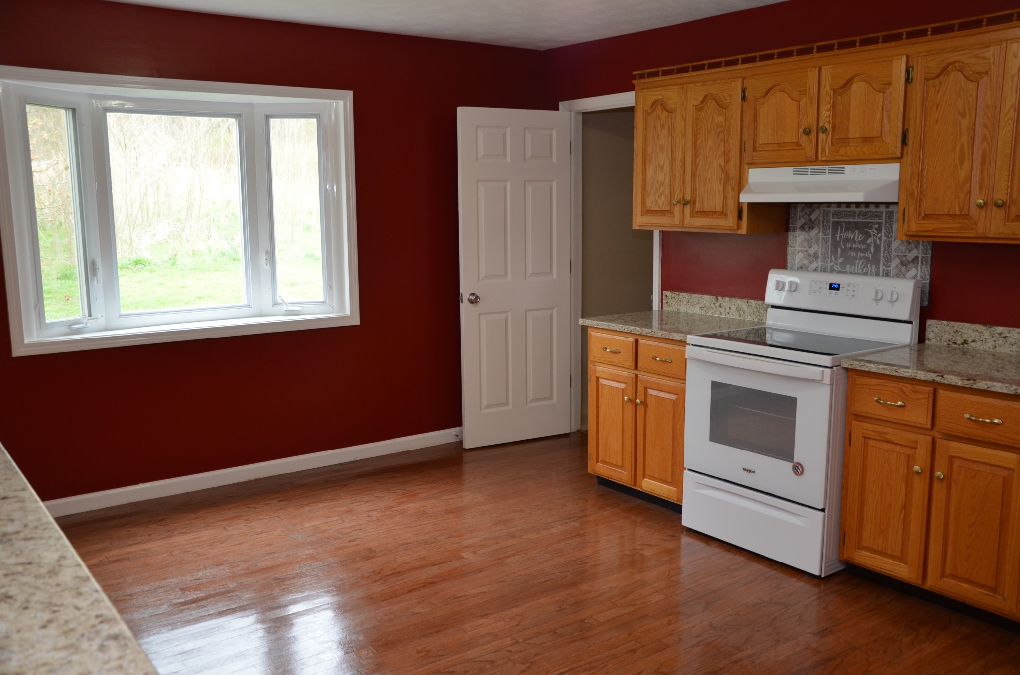 2742 Sherrilltown Road Watertown, TN 37184 - Photo 5 of 30 a kitchen with stainless steel appliances granite countertop a stove a sink and a refrigerator