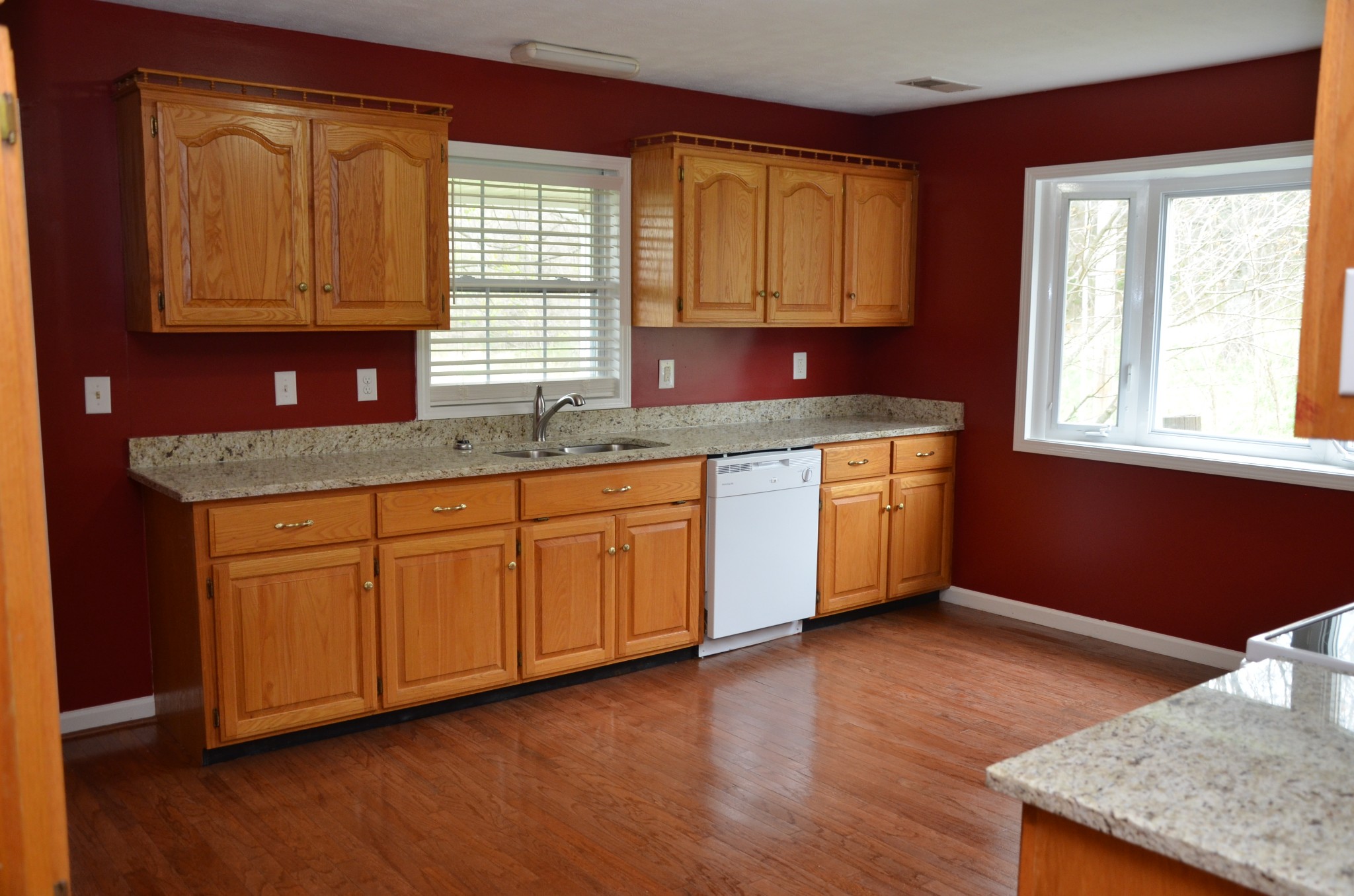 2742 Sherrilltown Road Watertown, TN 37184 - Photo 6 of 30 a kitchen with stainless steel appliances granite countertop wooden cabinets a sink and dishwasher with wooden floor