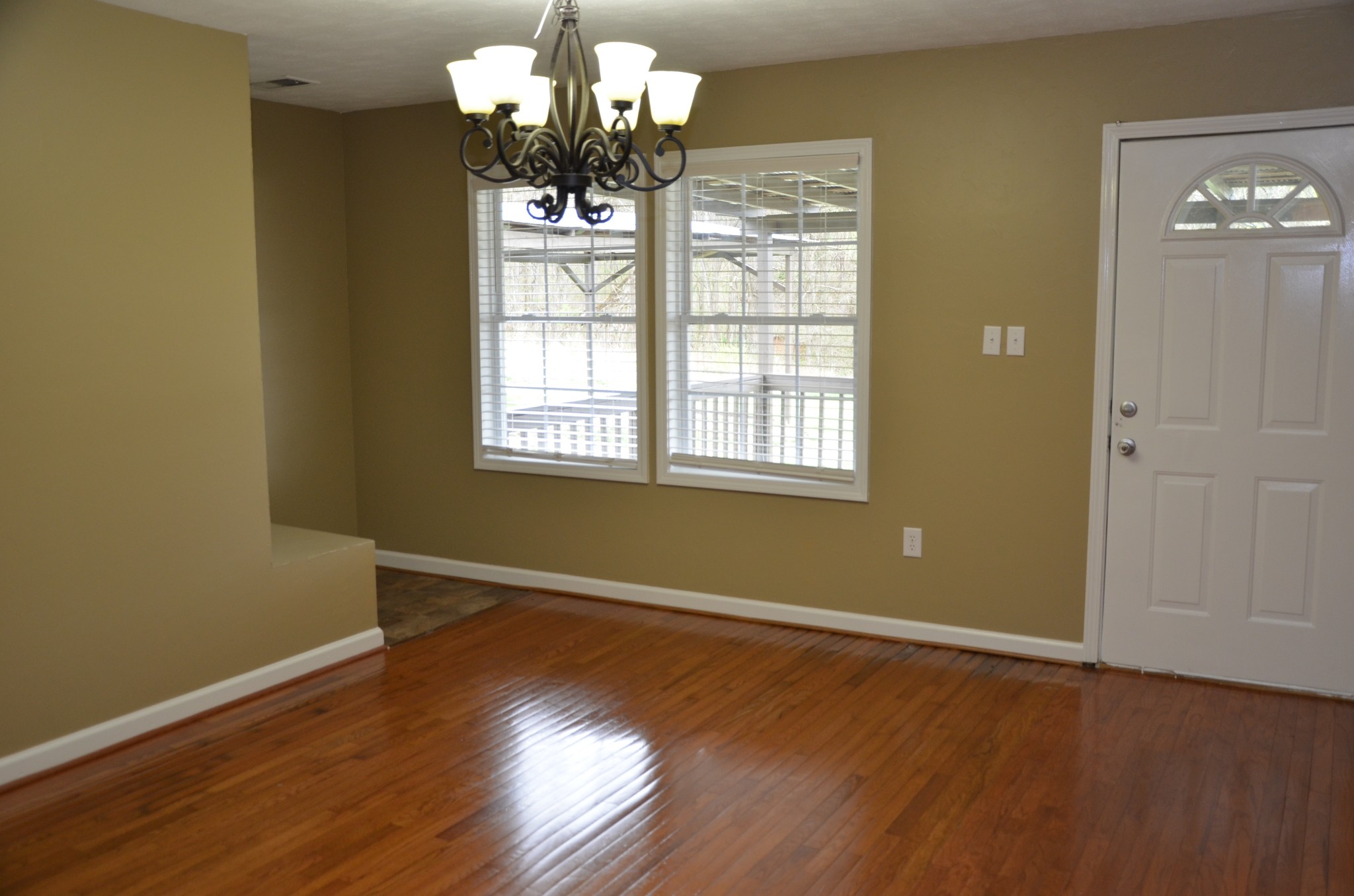 2742 Sherrilltown Road Watertown, TN 37184 - Photo 8 of 30 a view of an empty room with wooden floor and a window