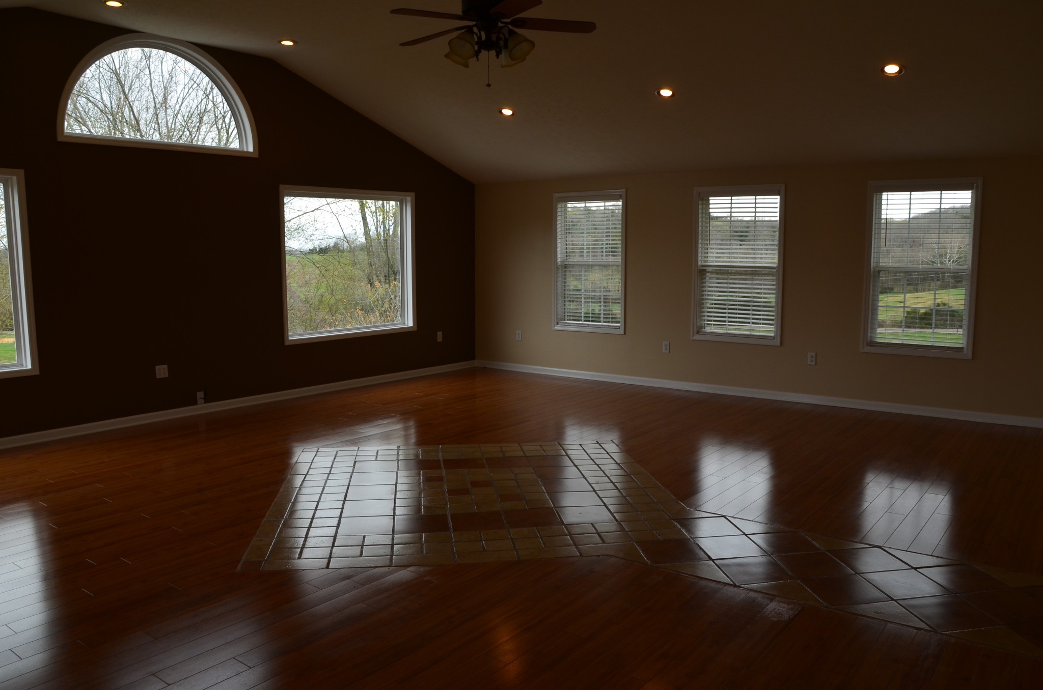2742 Sherrilltown Road Watertown, TN 37184 - Photo 10 of 30 a view of an empty room with wooden floor and a window