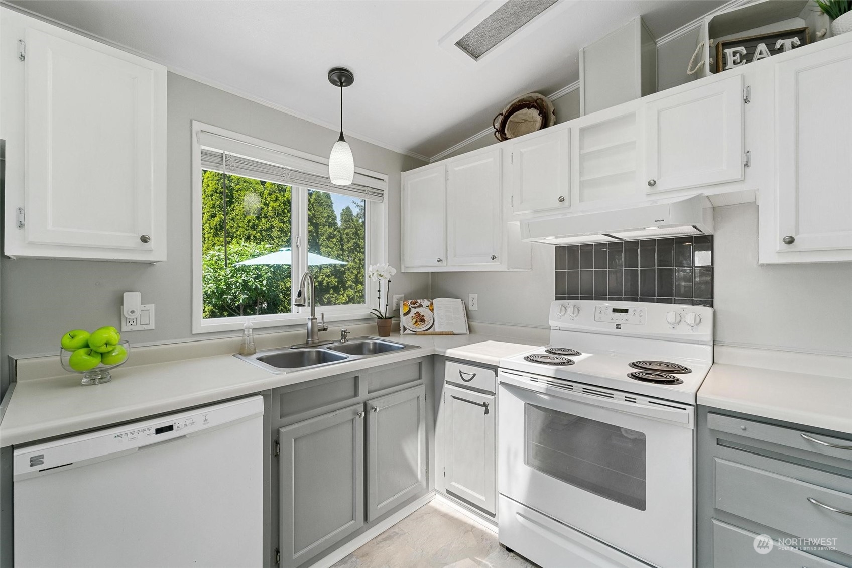 24323 S Park Bothell, WA 98021 - Photo 6 of 21 a kitchen with a white cabinets and white appliances