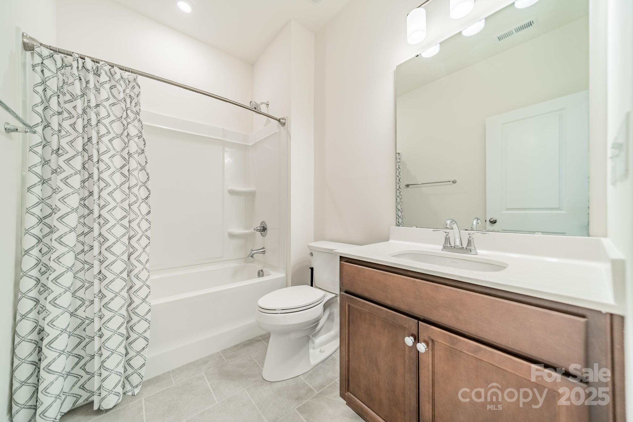 558 Red Wolf Lane Clover, SC 29710 - Photo 14 of 19 a bathroom with a sink a toilet and shower