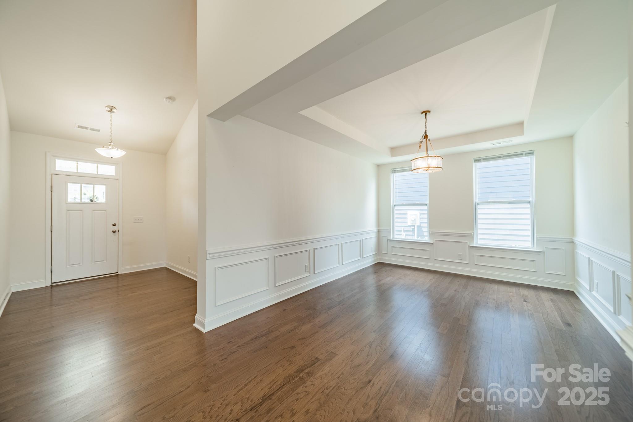 558 Red Wolf Lane Clover, SC 29710 - Photo 3 of 19 an empty room with wooden floor and windows