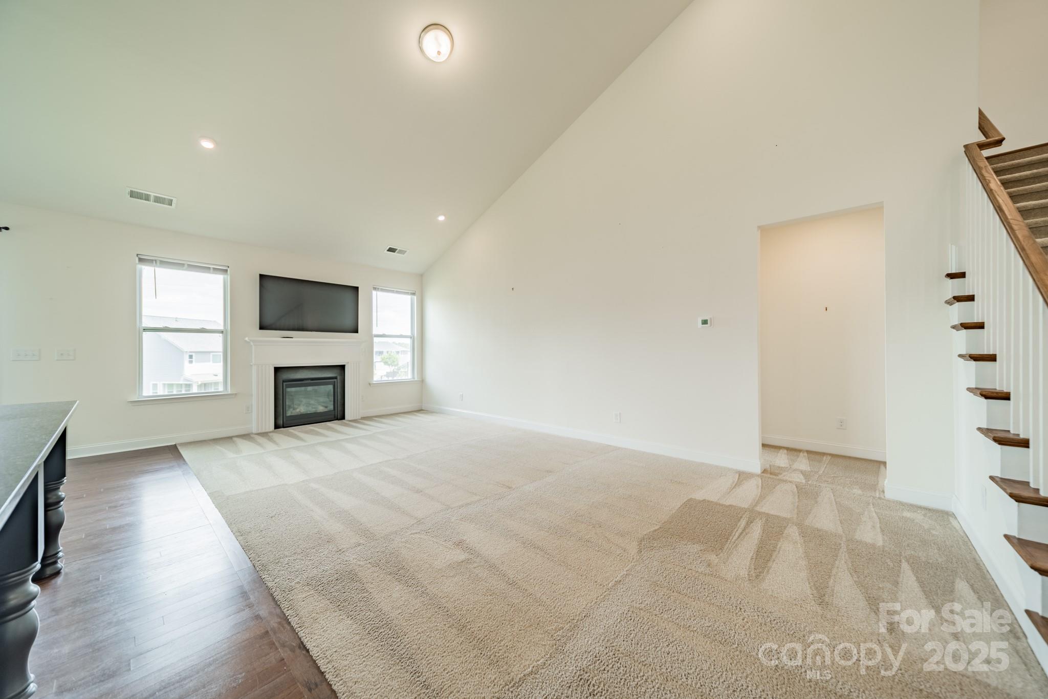 558 Red Wolf Lane Clover, SC 29710 - Photo 4 of 19 an empty room with windows and fireplace