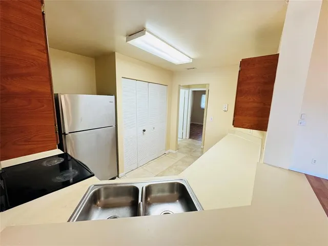 a view of a kitchen with a sink