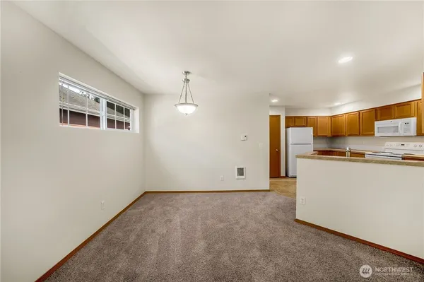 a view of kitchen and wooden floor