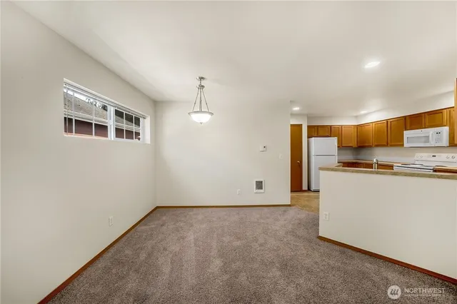 a view of kitchen and wooden floor