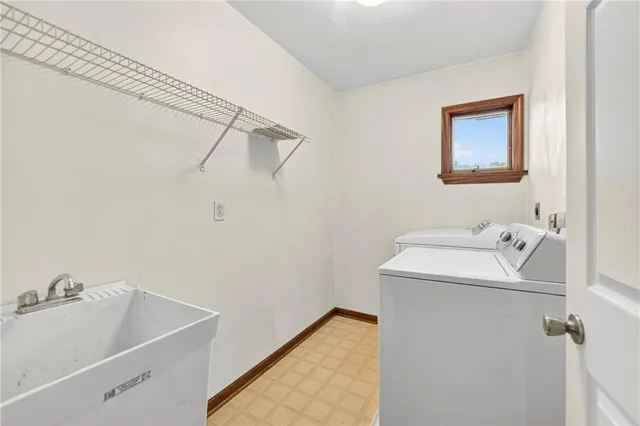 a bathroom with a sink and washing machine