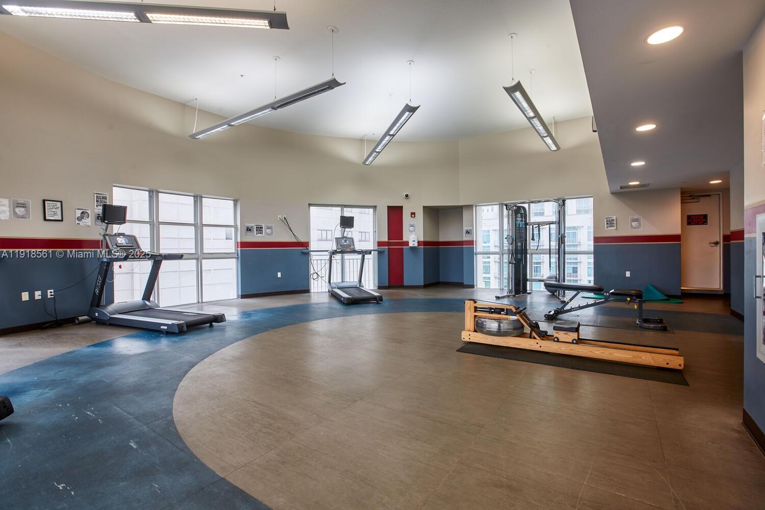 7285 Southwest 90th Street, Unit D613 Miami, FL 33156 - Photo 12 of 20 a view of a room with gym equipment