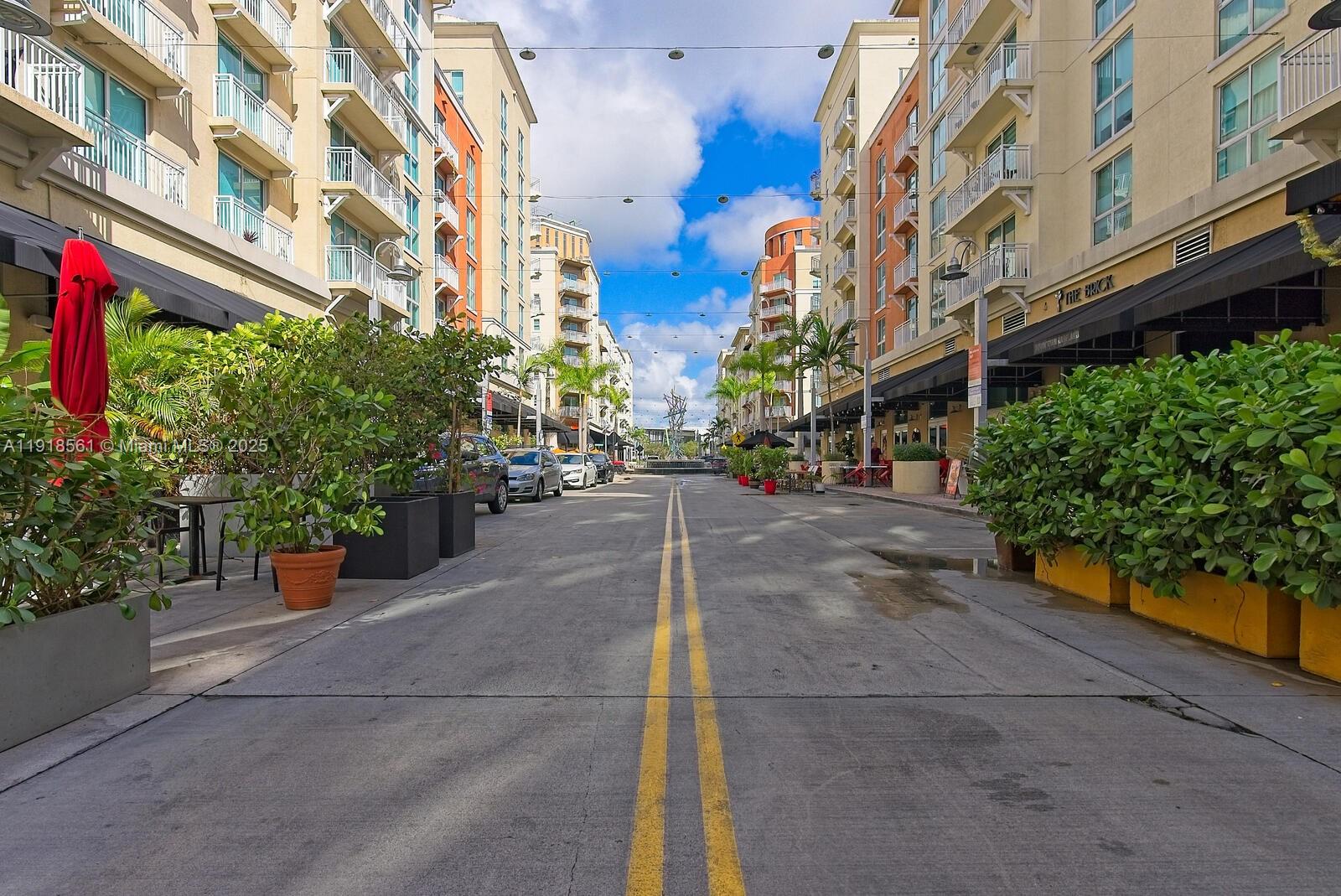 7285 Southwest 90th Street, Unit D613 Miami, FL 33156 - Photo 14 of 20 a view of a street with tall buildings