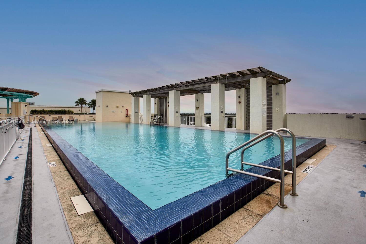 7285 Southwest 90th Street, Unit D613 Miami, FL 33156 - Photo 10 of 20 swimming pool with outdoor seating