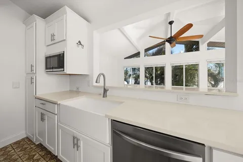 a kitchen with a sink and a window