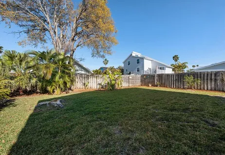 a view of a big yard next to a house