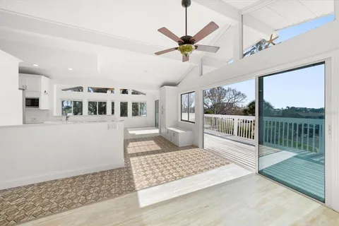a living room with wooden floor and furniture