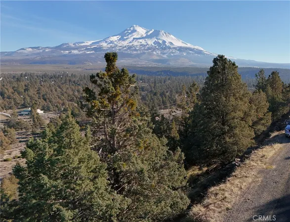 a view of a city with sunset in background