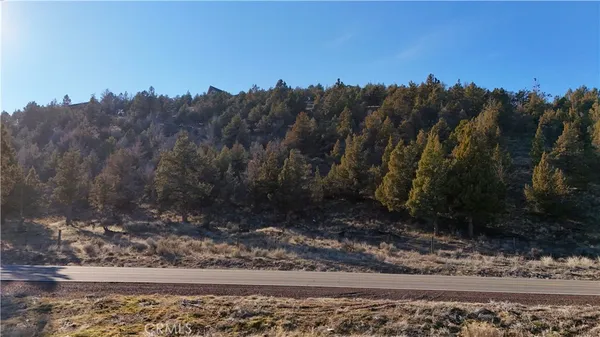 a view of balcony and yard