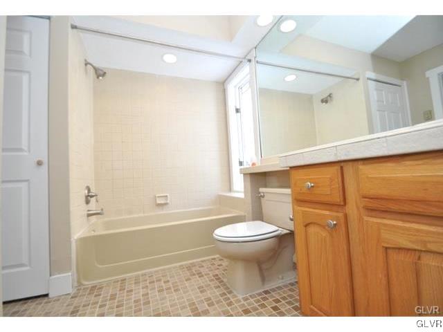 515 Rondaxe Lane Pocono Pines, PA 18350 - Photo 6 of 8 a bathroom with a sink toilet a mirror and shower