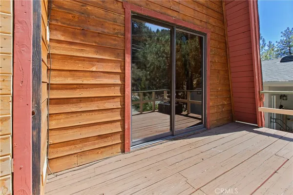 a view of front door and wooden floor