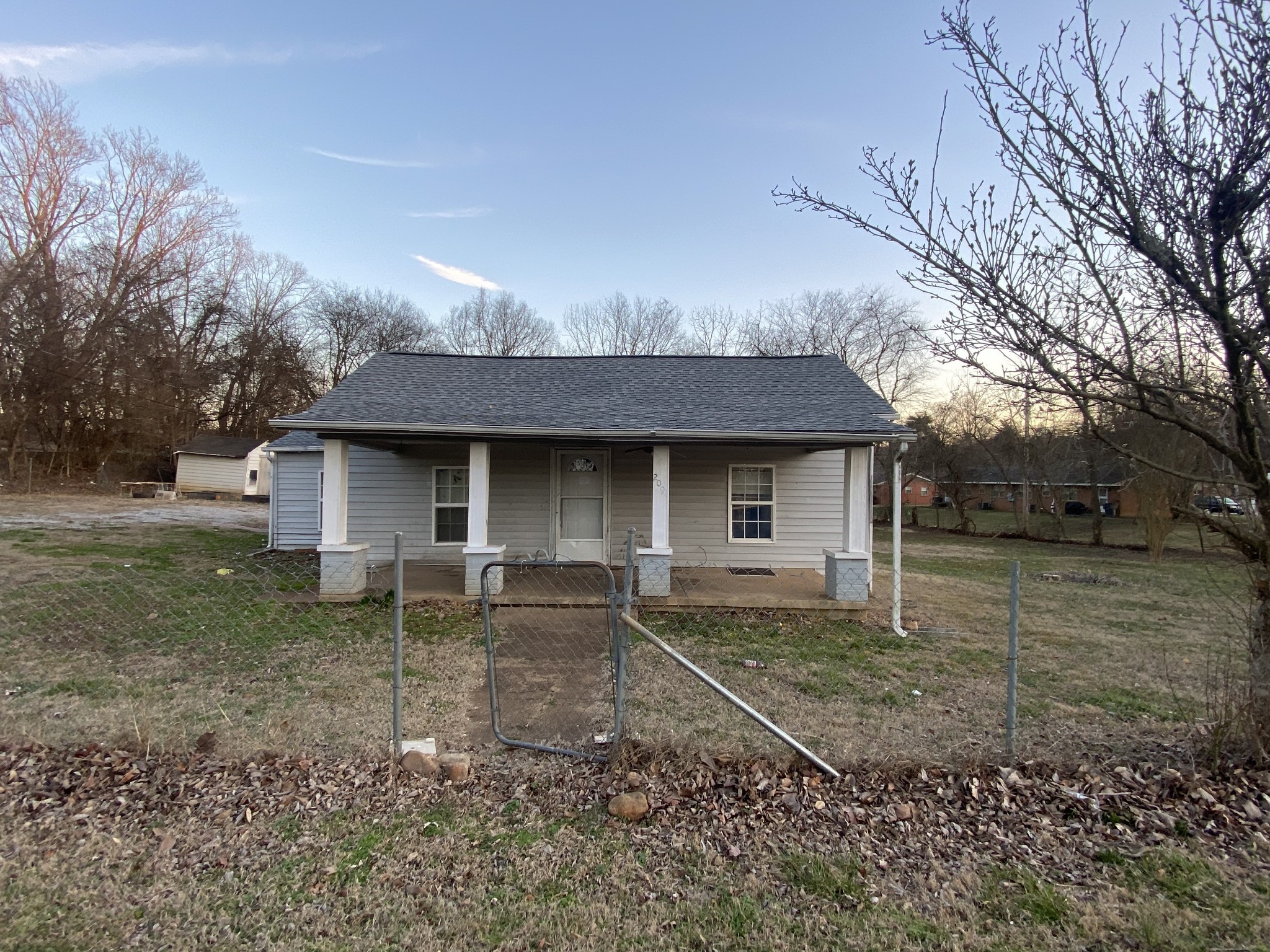 209 Old Morrison Road McMinnville, TN 37110 - Photo 1 of 12 a front view of a house with garden