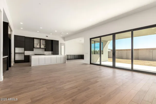 a view of a kitchen with a sink and a large window