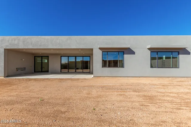 a front view of a house with large windows
