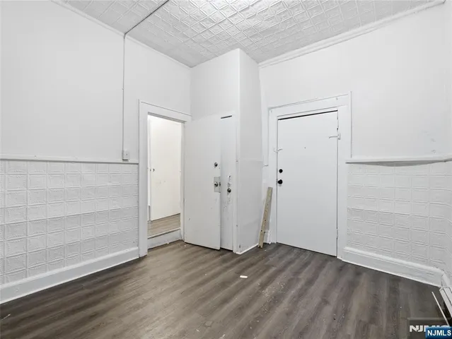 an empty room with wooden floor