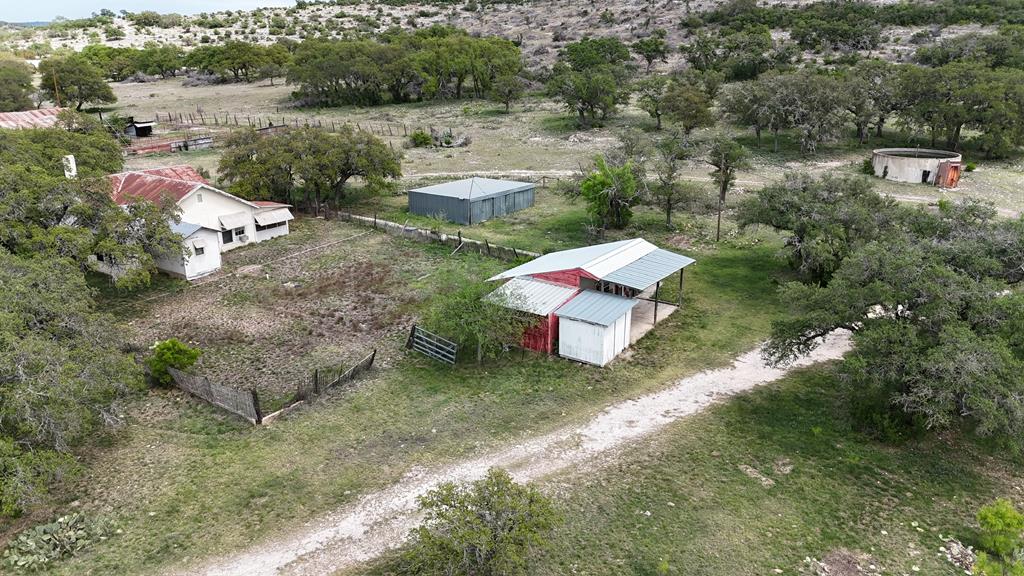 10347 Fm 674 Rocksprings, TX 78880 - Photo 1 of 1 an aerial view of a house with outdoor space